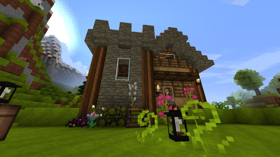 a simple Minecraft house exterior with a short tower 